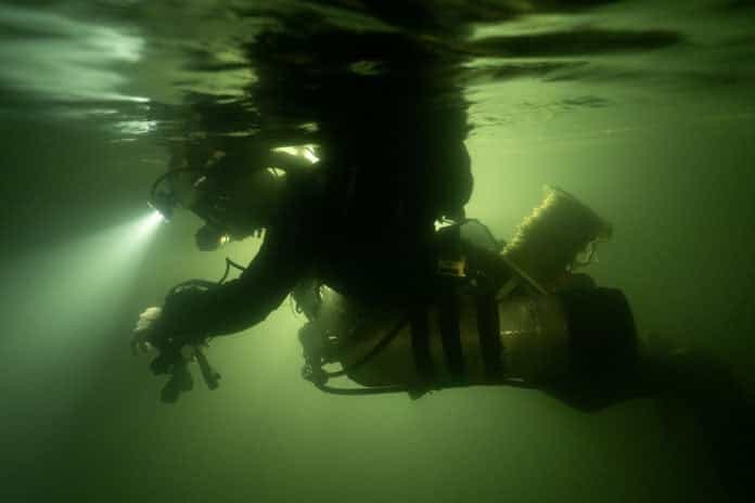 Diving in the underground river in Son Doong Cave.